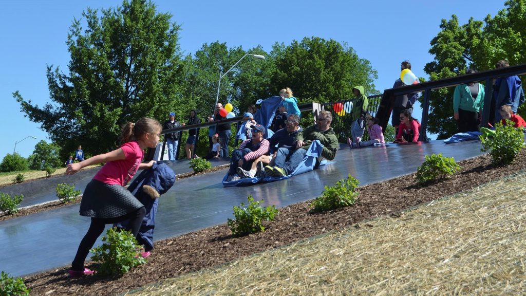 Individuals having fun sliding
