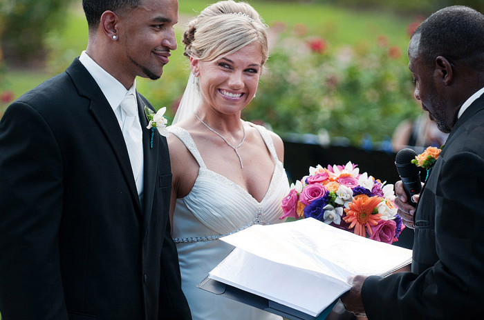 A bride and a groom at their beautiful wedding in Loose Park.